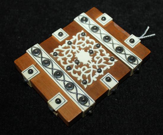 Indian plain wood card case decorated with ivory strapwork and metal bosses